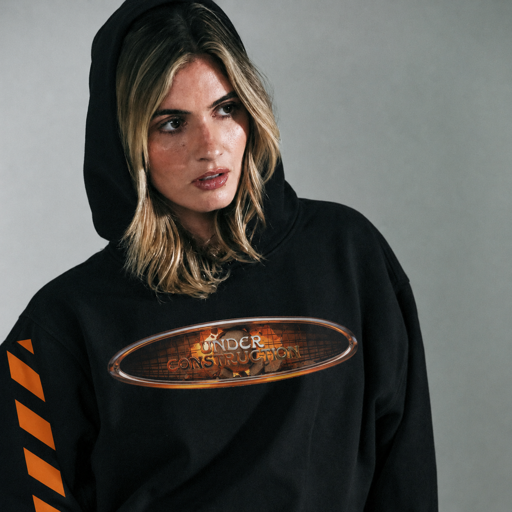 Model wearing UC Head Trip 2026 black hoodie with hood up