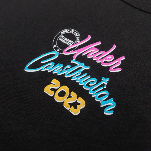 Close-up of the Hollywood Under Construction 2023 graphic on the black cropped tee