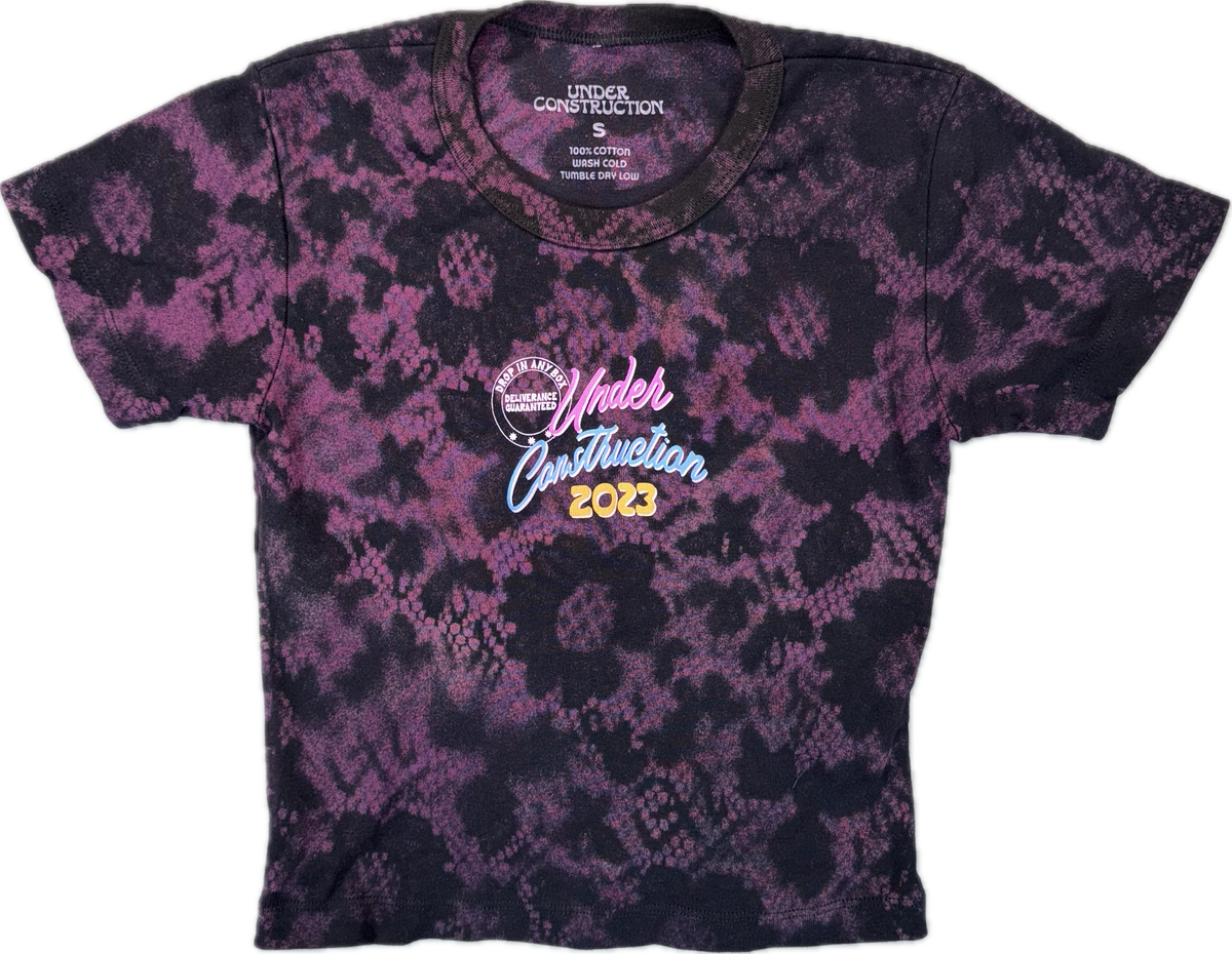 Overgrown Crop Tee in a purple and black floral dye pattern, front view