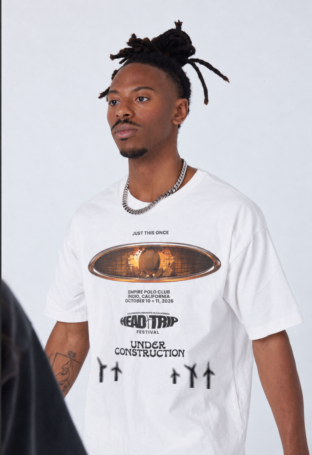 Close lifestyle view of UC Head Trip 2026 white tee