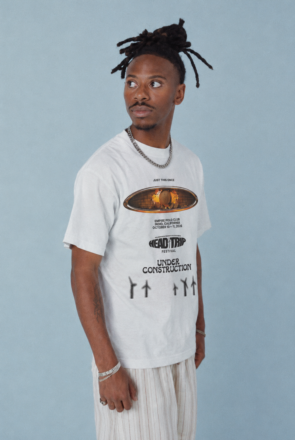 Three-quarter lifestyle view of UC Head Trip 2026 white tee